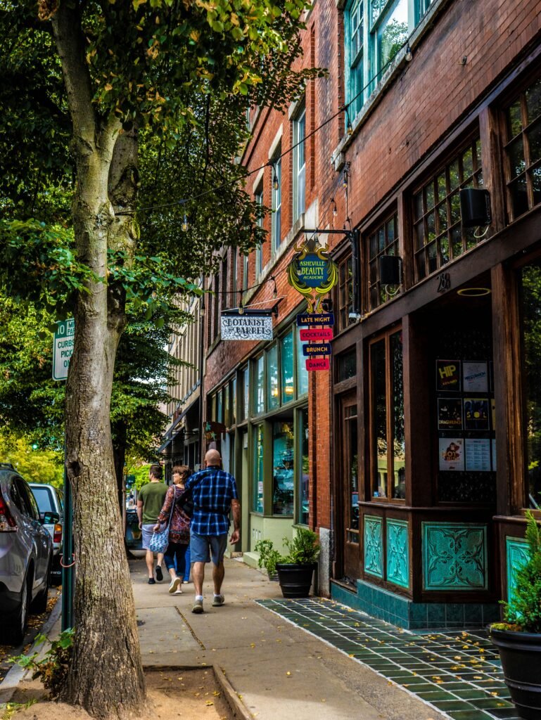 Asheville street with local storefronts and pedestrians